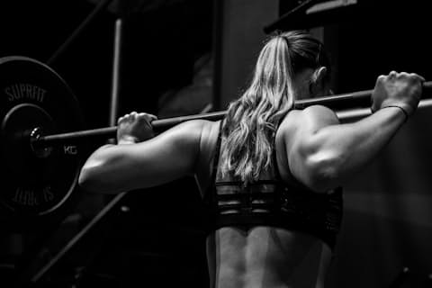 Woman doing a bodyweight squat at home
